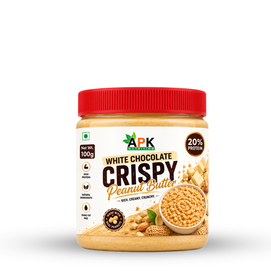 APK Nutrition 100g White Chocolate Crispy Peanut Butter jar label showing nutritional facts, ingredients, and a bowl of crunchy peanut butter with white chocolate chunks.