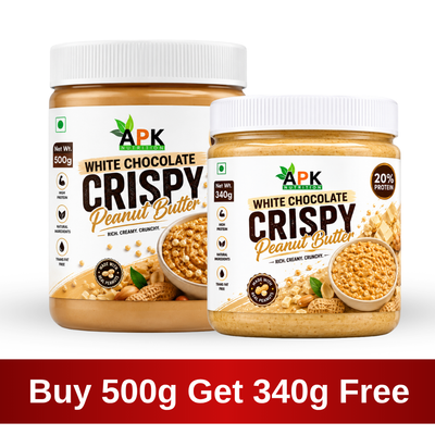 APK Nutrition 500g White Chocolate Crispy Peanut Butter jar featuring dark chocolate chunks, whole peanuts, a 19% protein claim, and a family enjoying healthy snacks.